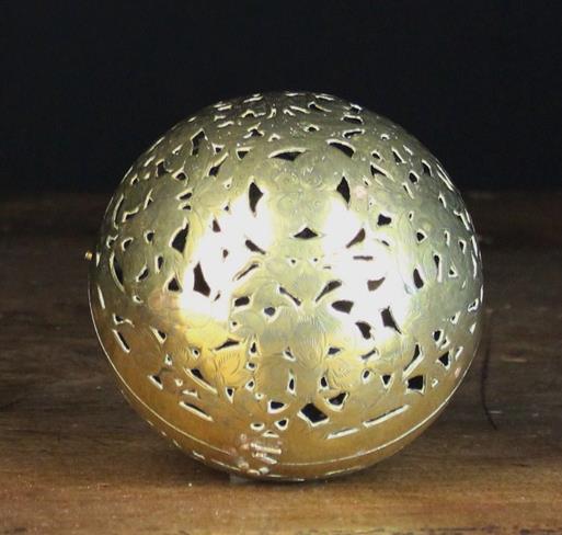 A 19th Century Spherical Brass Hand Warmer pierced and engraved with birds amidst flowers & foliage