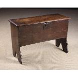 A Small Early 17th Century Boarded Oak Coffer. The interior fitted with a lidded till to one end.