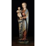 An Early 17th Century Polychromed Carving of The Virgin & Child.