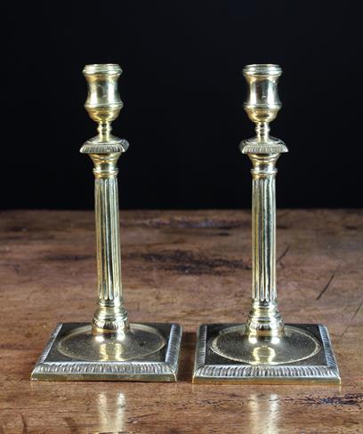 A Pair of Georgian Brass Candlesticks,