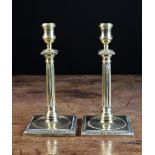 A Pair of Georgian Brass Candlesticks,