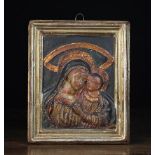 A Stucco Plaque relief moulded with head & shoulders of Madonna & Child;