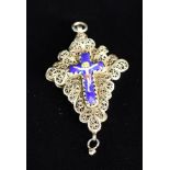 A Silver Filigree Pendant mounted with an enamelled crucifix either side, 2½ in (6.5 cm) in length.