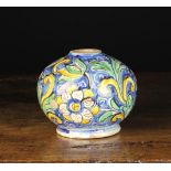 A 16th Century Venetian Maiolica Jar (lacking rim) decorated with scrolling foliage in blue,