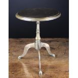 A 19th Century Brass Trivet styled as a tripod table.