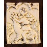 A Small Rectangular Ivory Plaquette carved with Samson & The Lion, 1¾ in x 1½ in (4.5 cm x 3 cm).