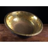 A Large 18th Century Sheet Brass bowl with out-turned rim and a circular centre/base panel joined