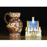 A 19th Century Slipware Jug and A Prattware Money-box.