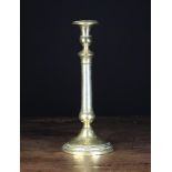 A Georgian Brass Candlestick, 12 in (30 cm) in height.