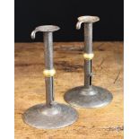 A Pair of 19th Century Brass-Banded Iron Hog-scraper Candlesticks, 9 in (23 cm) in height.