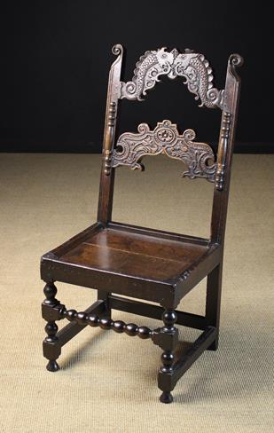 A Fine Example of a 17th Century Joined Oak South Yorkshire Back Stool, of generous proportions,