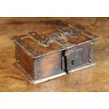 A Small 16th/17th Century Oak Casket bound in iron straps with iron swing handle to the lid,