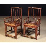 A Pair of Chinese Lacquered Ash Armchairs, 39½ in (100 cm) high, 19¾ in (50 cm) in width.