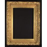 A Large Victorian Moulded Gilt Frame richly decorated with sprays of flowers and scrolling acanthus