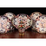 Five Crown Derby Plates and a Royal Crown Derby 'Old Imari' Jar & Cover, 6½ in (16.5 cm) in height.