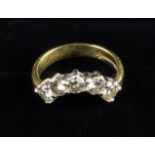 An 18 Carat Gold & Diamond Ring set with five stones in a crescent arch.