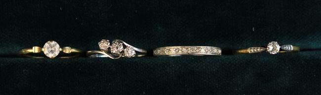 An 18 Carat Gold & Platinum three stone Diamond Ring.