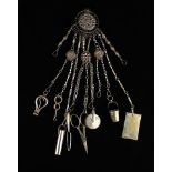 A Fine Victorian Thornhill Chatelaine with various clip-on implements including a notelet holder,