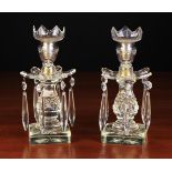 A Pair of Late 19th Century Cut Glass Lustre Candlesticks hung with faceted drops around a baluster