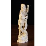 An Antique Ivory Okimono, Circa 1900 carved as a Cormorant Fisherman,