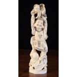 A Late 19th Century Japanese Ivory Carving of a smiling man holding aloft a child,