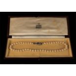 A Pearl Necklace with 18 Carat Clasp, in a Garrard & Co Ltd case.