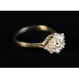 A Pretty Nine Stone Diamond & 18 Carat Gold Ring.