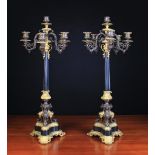 A Pair of French Empire Bronze & Gilt Bronze Six-light Candelabra.