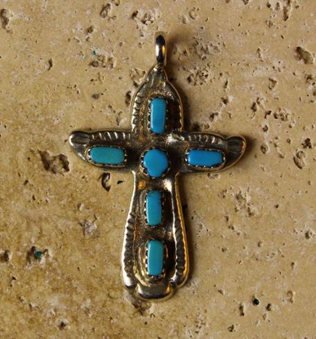 An Intricate and Attractive Silver Cross Pendant, set with turquoise stones.