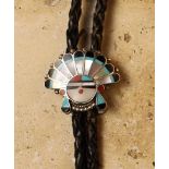 An Intricate and Detailed Vintage Silver "Sunface" with Headdress Bolo, inlaid with turquoise, jet,