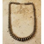 A Large and Attractive Engraved Vintage Silver Zuni Beaded Necklace, of diminishing proportions.