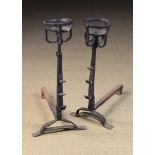 A Pair of 17th/Early 18th Century Wrought Iron Cresset-topped Fire Dogs with adjustable spit hooks