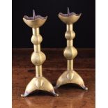 A Pair of Gothic Brass Pricket Candlesticks.