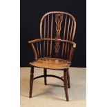 An Early 19th Century Yew-wood Windsor Armchair.