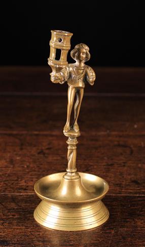 A 15th/16th Century Style Figural Brass Candlestick.