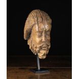 A Late 12th /Early 13th Century Romanesque Carved Wooden Head in the form of Christ,