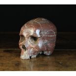 A Large Late 19th Century Italian Griotte Marble Momento Mori carved in the form of a skull. Approx.