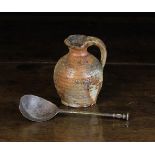 A Small Early 17th Century Salt-glazed Stoneware Jar with ribbed ovoid body,