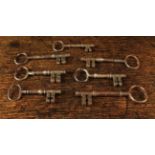 A Group of Seven 18th Century Iron Keys ranging from 4 in (10 cm) to 3¼ in (8 cm) in length.