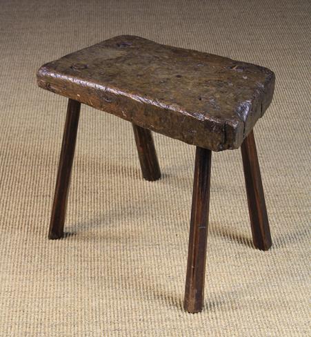 An Early 19th Century Primitive Stool. The 3 inch (7.