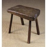 An Early 19th Century Primitive Stool. The 3 inch (7.