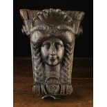 An Antique Figural Oak Capital/Corbel carved in the form of a female head wearing a crown of fanned