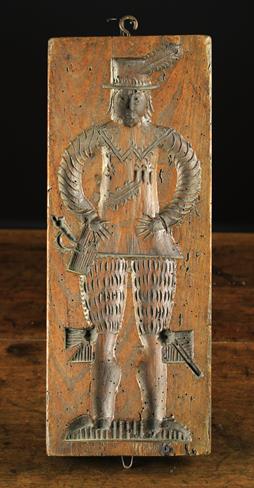 A Late 17th/Early 18th Century Ginger Bread Mould with a finely dressed gentleman to one side and a