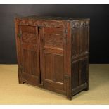 A 17th Century Boarded Oak Cupboard.