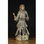 A Late 17th Century Portuguese Oak Carving of a Figure wearing tunic and sandals standing on a