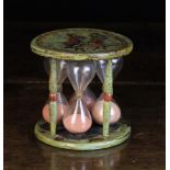 An 18th Century Venetian Arte Povera Hourglass with four glass chambers housed between turned