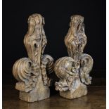 A Pair of 15th Century Carved Oak 'Poppy-head' Pew Finials, 13½ in (34 cm) in height.