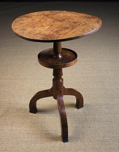 A Rustic Elm Two Tiered Tripod Table.