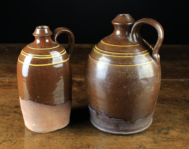 Two Late 19th Century Wetheriggs Bottles made by Schofields and decorated with bands of yellow slip