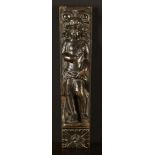 A 17th Century Oak Figural Pilaster carved with a cherub stood on a ledge with a scrolled capital